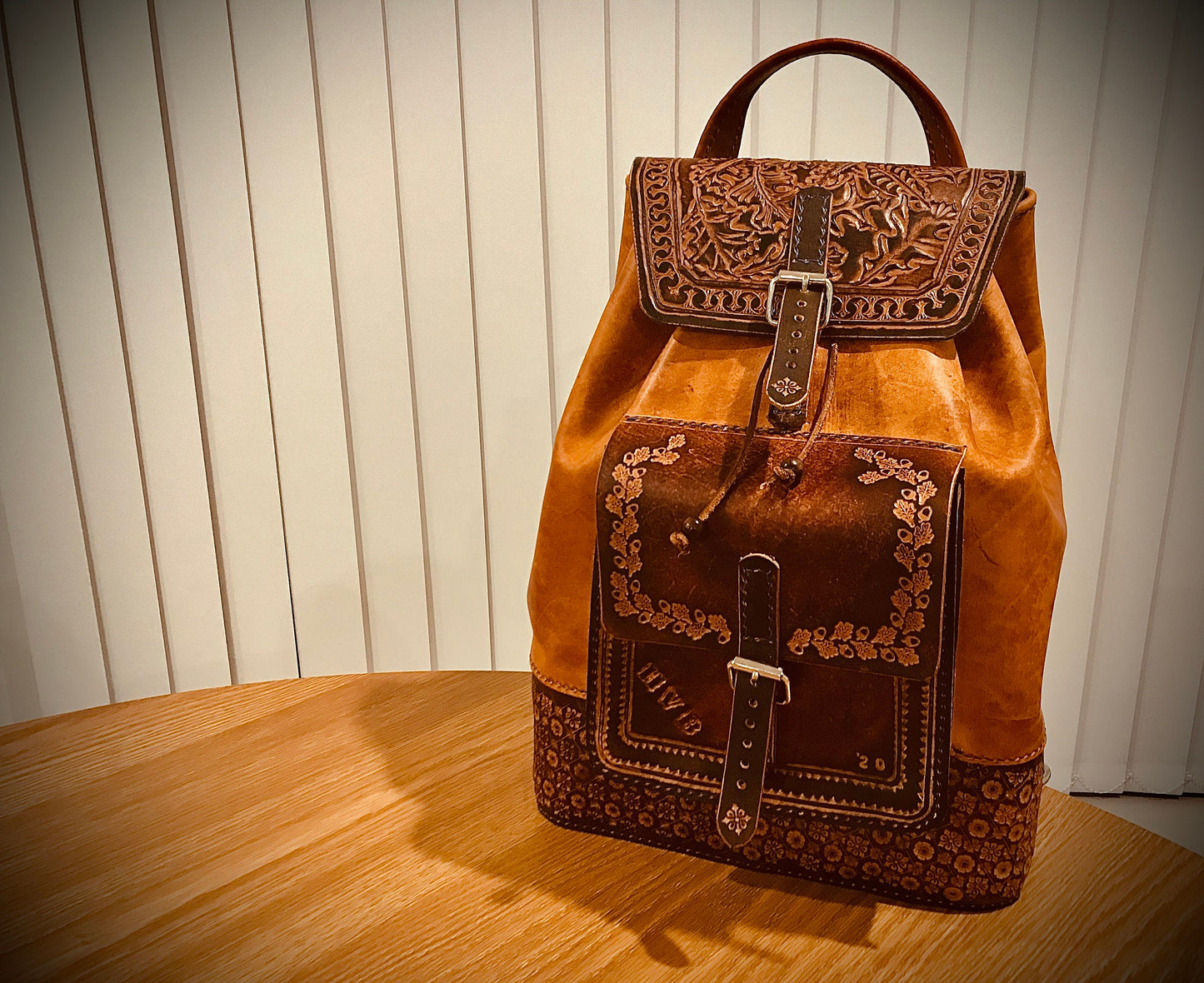 Hand embossed full leather backpack